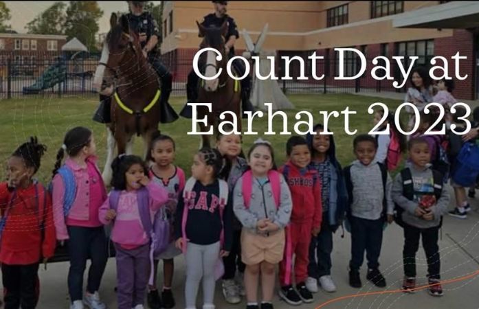   students on the front lawn of earhart school